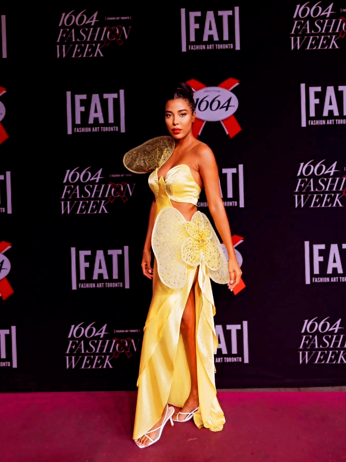 Yellow petal couture on flower-strewn runway
